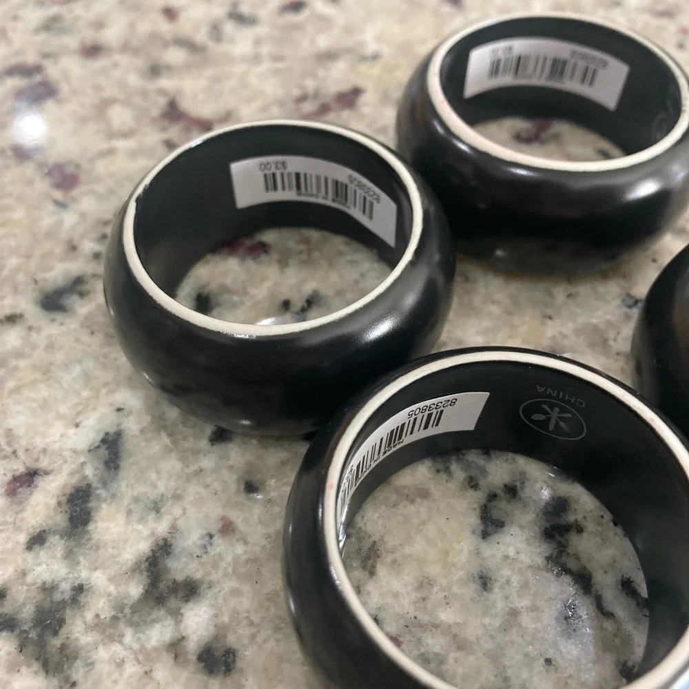 NWT Pier 1 Imports set of 4 black with white on one side ceramic napkin rings
